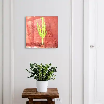 Grüner Kaktus an roter Wand