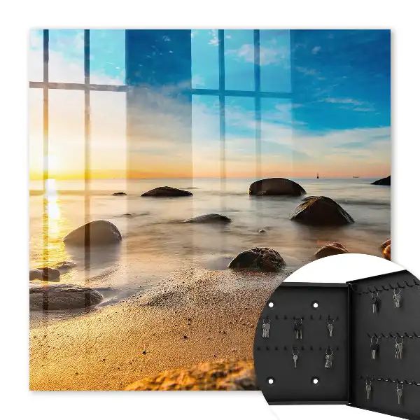 Sonnenuntergang am Meer mit Meer und Steinen