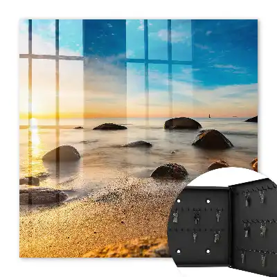 Sonnenuntergang am Meer mit Meer und Steinen
