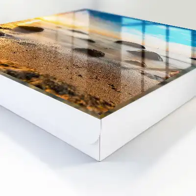 Sonnenuntergang am Meer mit Meer und Steinen
