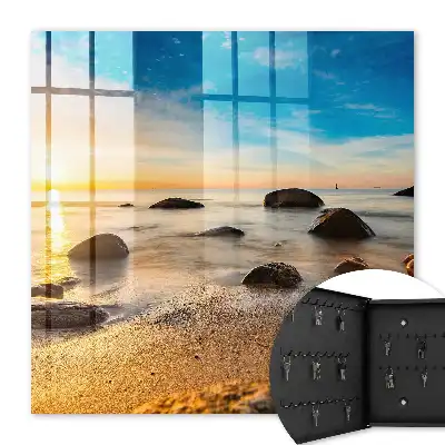 Sonnenuntergang am Meer mit Meer und Steinen