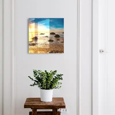 Sonnenuntergang am Meer mit Meer und Steinen
