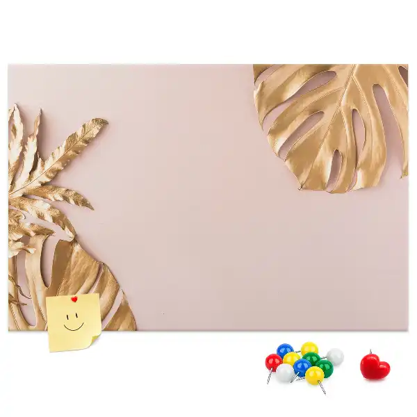 Pinnwand mit goldenen tropischen Blättern