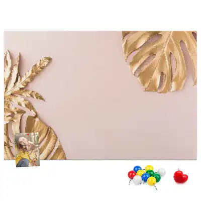Pinnwand mit goldenen tropischen Blättern
