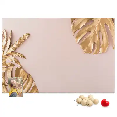 Pinnwand mit goldenen tropischen Blättern