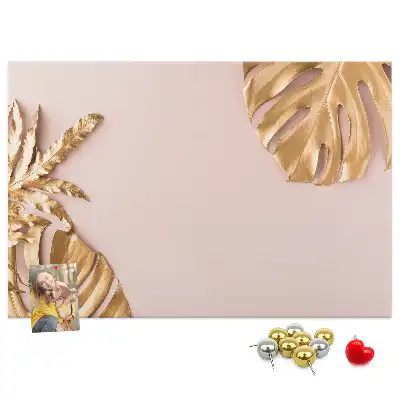 Pinnwand mit goldenen tropischen Blättern