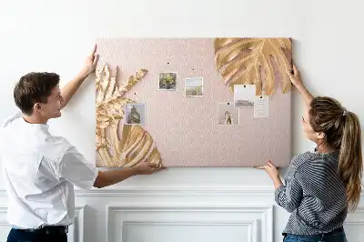 Pinnwand mit goldenen tropischen Blättern