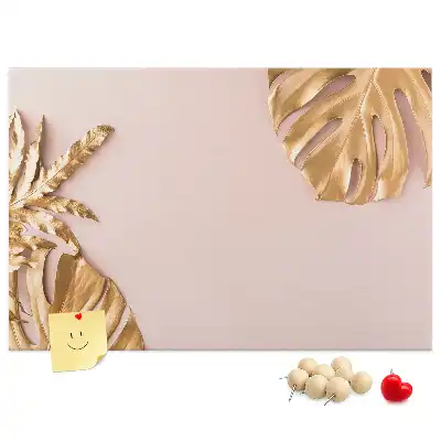 Pinnwand mit goldenen tropischen Blättern