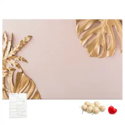 Pinnwand mit goldenen tropischen Blättern