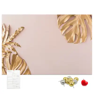 Pinnwand mit goldenen tropischen Blättern