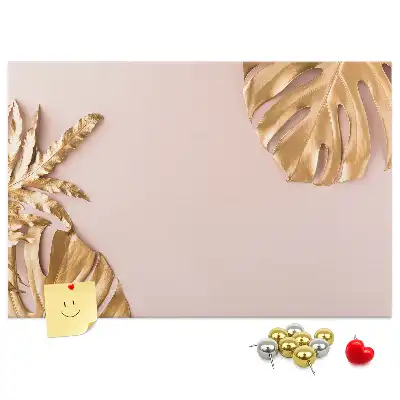 Pinnwand mit goldenen tropischen Blättern