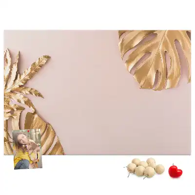 Pinnwand mit goldenen tropischen Blättern
