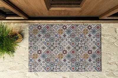 Fußmatte vor dem Haus Mosaik