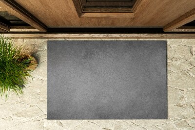 Fußmatte vor der Tür im Freien Roher Beton