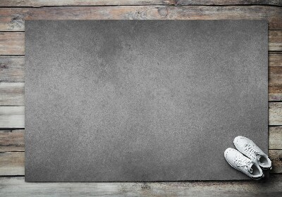 Fußmatte vor der Tür im Freien Roher Beton