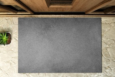 Fußmatte vor der Tür im Freien Roher Beton